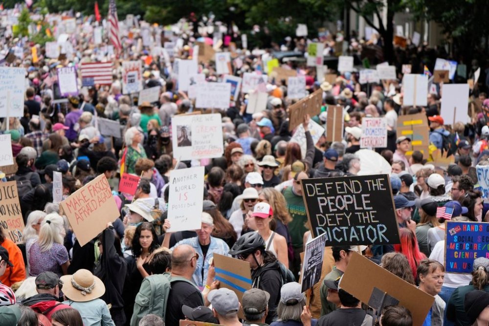 FILE - Demonstrators take part in the