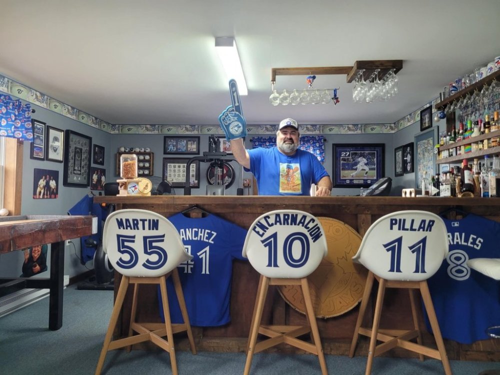 Curtis Halliday poses in his Blue Jays themed