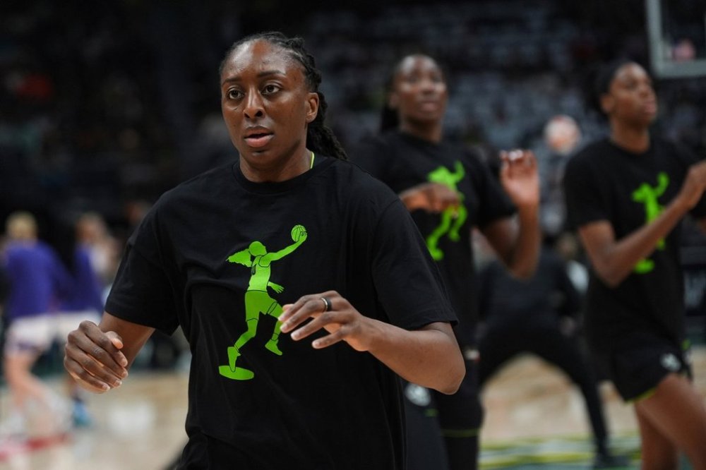 FILE - Seattle Storm forward Nneka Ogwumike wears a warmup shirt depicting former Storm point guard Sue Bird after her statue unveiling earlier in the day, before facing the Phoenix Mercury in a WNBA basketball game, Sunday, Aug. 17, 2025, in Seattle. (AP Photo/Lindsey Wasson, file)