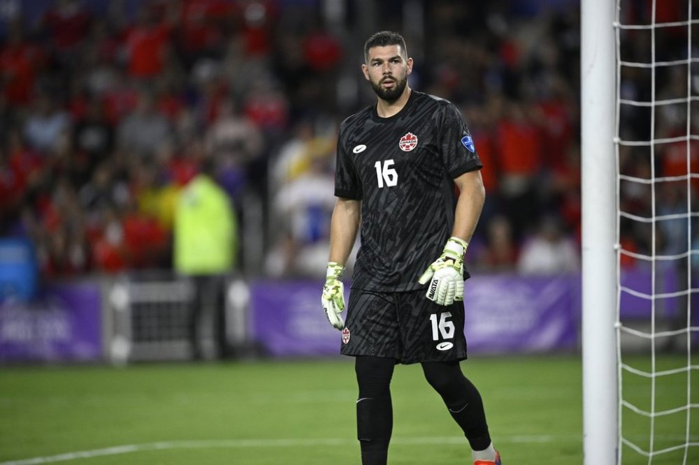 Canada goalkeeper Maxime Crepeau (16) sets up for a play against Chile during the first half of a Copa America Group A soccer match, Saturday, June 29, 2024, in Orlando, Fla. (AP Photo/Phelan M. Ebenhack)