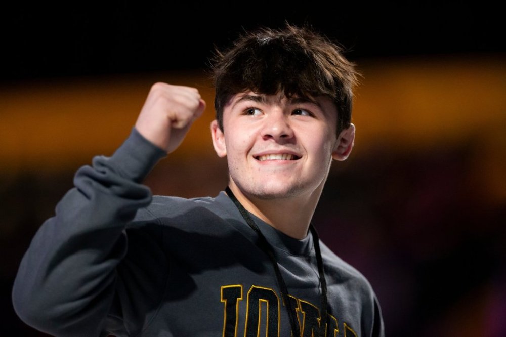 FILE - Wrestler Bo Bassett greets the crowd during the FloWrestling Night in America wrestling exhibition at XTream Arena in Coralville, Iowa, Wednesday, Feb. 26, 2025. (Nick Rohlman/The Gazette via AP, File)