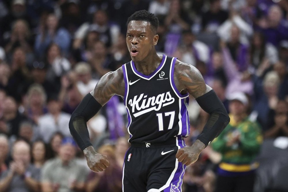 Sacramento Kings guard Dennis Schröder celebrates after guard Zach Lavine scored during the first half of an NBA basketball game against the Utah Jazz, Friday, Oct. 24, 2025, in Sacramento, Calif. (AP Photo/Sara Nevis)