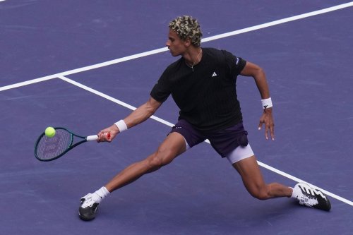 Gabriel Diallo of Canada plays a forehand return to Zizou Bergs, of Belgium, during the men's singles match of the Shanghai Masters tennis tournament at Qizhong Forest Sports City Tennis Center, in Shanghai, China, Tuesday, Oct. 7, 2025. (AP Photo/Andy Wong)