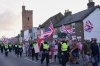 FILE - Police officers escort protesters near the Bell Hotel in Epping, London, Sunday, Aug. 31, 2025 after a temporary injunction that would have blocked asylum seekers from being housed at the hotel was overturned. (AP Photo/Alberto Pezzali, File)