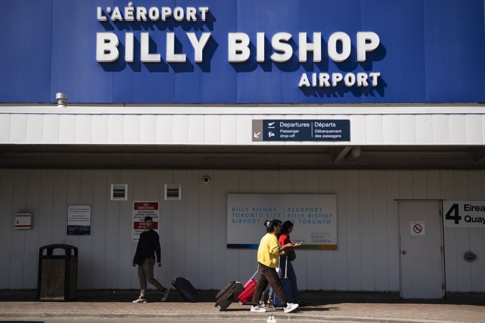 People arrive at Billy Bishop Airport in Toronto on Friday, July 19, 2024. THE CANADIAN PRESS/Christopher Katsarov