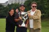 Xander Schauﬀele, of the U.S., poses for a photo with his parents, Chen Ping-Yi, left, and Stefan Schauffele, as he won the Baycurrent Classic golf tournament at the Yokohama Country Club in Yokohama, near Tokyo, Sunday, Oct. 12, 2025. (AP Photo/Hiro Komae)