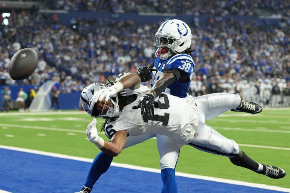 Indianapolis Colts' Chris Lammons (38) breaks up a pass intended for Las Vegas Raiders wide receiver Jakobi Meyers (16) during the second half of an NFL football game, Sunday, Oct. 5, 2025, in Indianapolis. (AP Photo/AJ Mast)