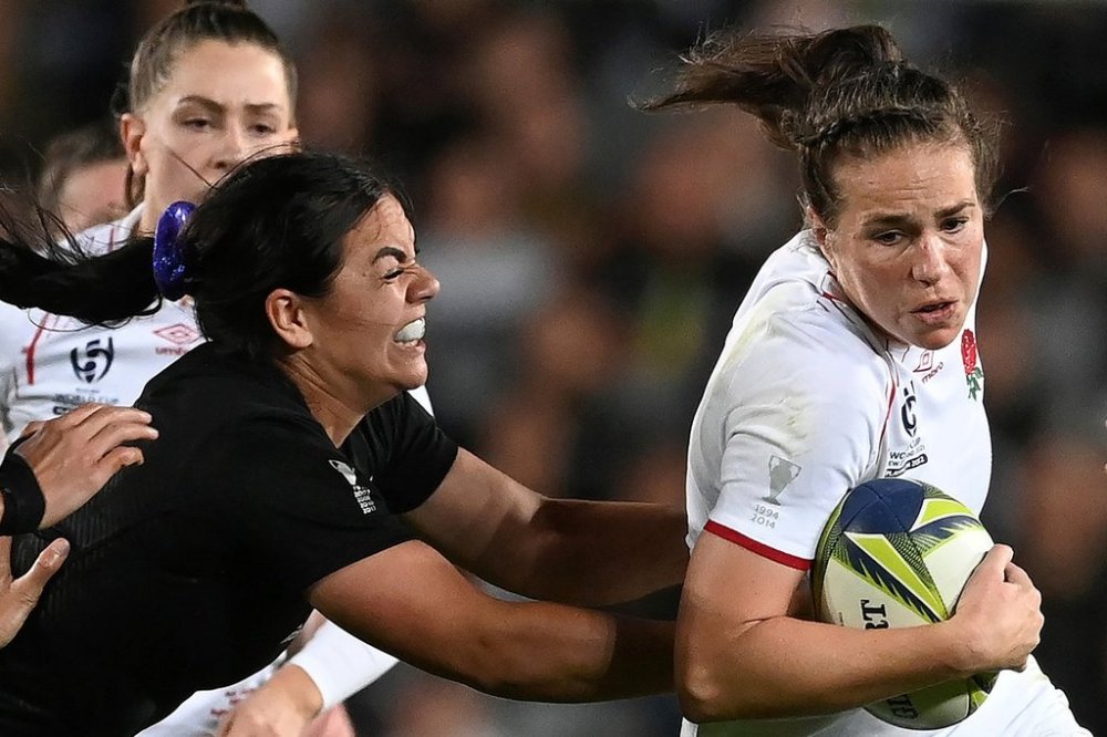 England's Emily Scarratt, right, is tackled by New Zealand's Stacey Fluhler during the final of the women's rugby World Cup at Eden Park in Auckland, New Zealand, on Nov. 12, 2022. (Andrew Cornaga/Photosport via AP, File)