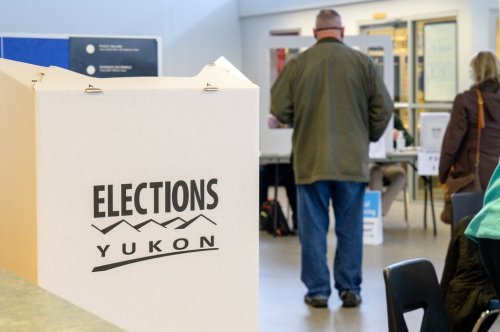 Voters and poll workers are shown at a Whitehorse polling station during the Yukon election on Monday, April 12, 2021. THE CANADIAN PRESS/Mark Kelly