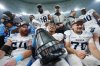Toronto Argonauts' Royce Metchie (9) holds the Grey Cup as he poses with teammates after defeating the Winnipeg Blue Bombers in CFL football action at the 111th Grey Cup in Vancouver on Sunday, November 17, 2024. Hosting the Grey Cup game and festival generated $121.9 million in economic impact for Vancouver, the CFL announced Wednesday THE CANADIAN PRESS/Darryl Dyck