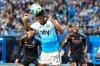 Charlotte FC defender Adilson Malanda (29) heads the ball away from New York City FC during the first half of Game 3 in the first round of MLS soccer's Eastern Conference playoffs Friday, Nov. 7, 2025, in Charlotte, N.C. (AP Photo/Chris Carlson)