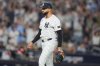 New York Yankees pitcher Devin Williams prepares for the next batter during the seventh inning of Game 3 of baseball's American League Division Series against the Toronto Blue Jays, Tuesday, Oct. 7, 2025, in New York. (AP Photo/Frank Franklin II)