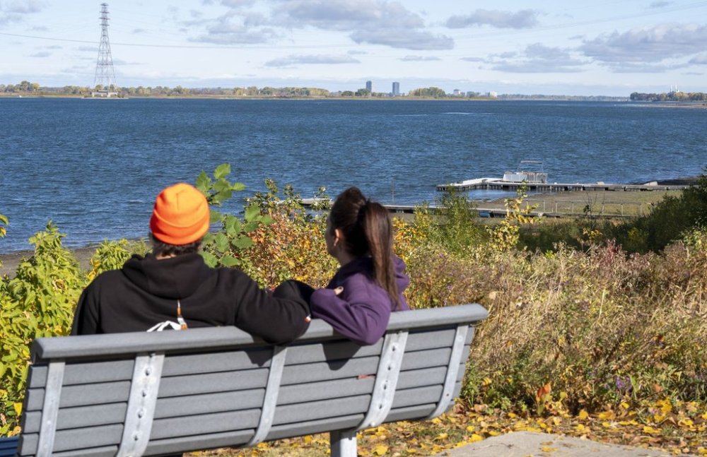Finding out your partner has been keeping financial secrets from you — whether it's hiding debt, concealing big-ticket purchases, or had an undisclosed bank account — can be hurtful and even a deal breaker for many couples. A couple looks at the view along the shoreline in the Montreal suburb of Boucherville on the south shore of the St. Lawrence River on Wednesday, Oct. 8, 2025. THE CANADIAN PRESS/Christinne Muschi