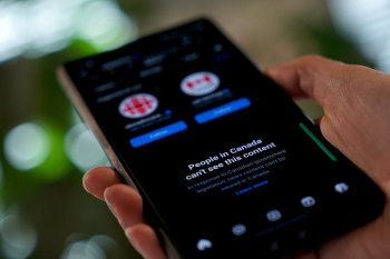 A smartphone showing Meta's block on Canadian news content is shown in a photo illustration in Toronto on Thursday, Aug. 1, 2024. THE CANADIAN PRESS/Giordano Ciampini
