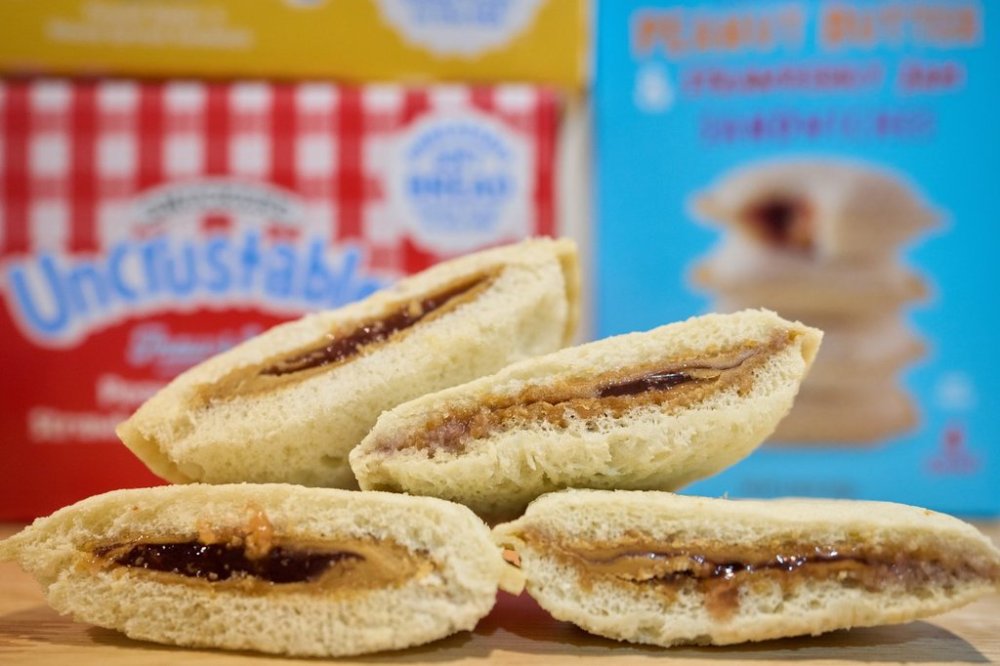Crust-less sandwiches from Smucker's and Trader Joe's are displayed, Wednesday, Oct. 15, 2025, in Detroit. (AP Photo/Ryan Sun)