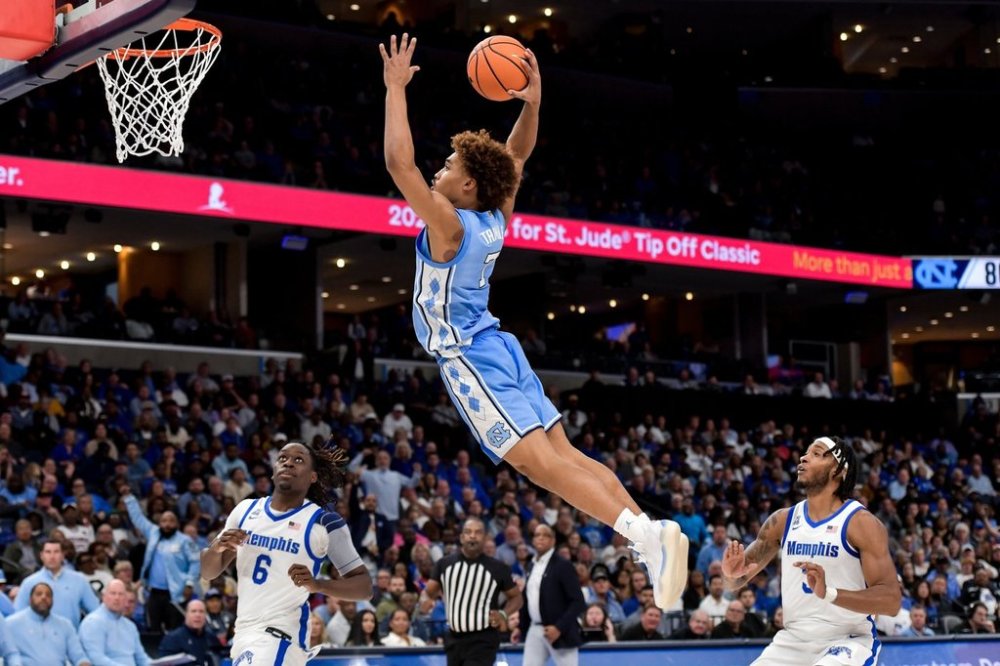 FILE - North Carolina guard Seth Trimble (7) dunks against Memphis during the Hoops for St. Jude Tip Off Classic NCAA college basketball exhibition game Tuesday, Oct. 15, 2024, in Memphis, Tenn. (AP Photo/Brandon Dill, File)