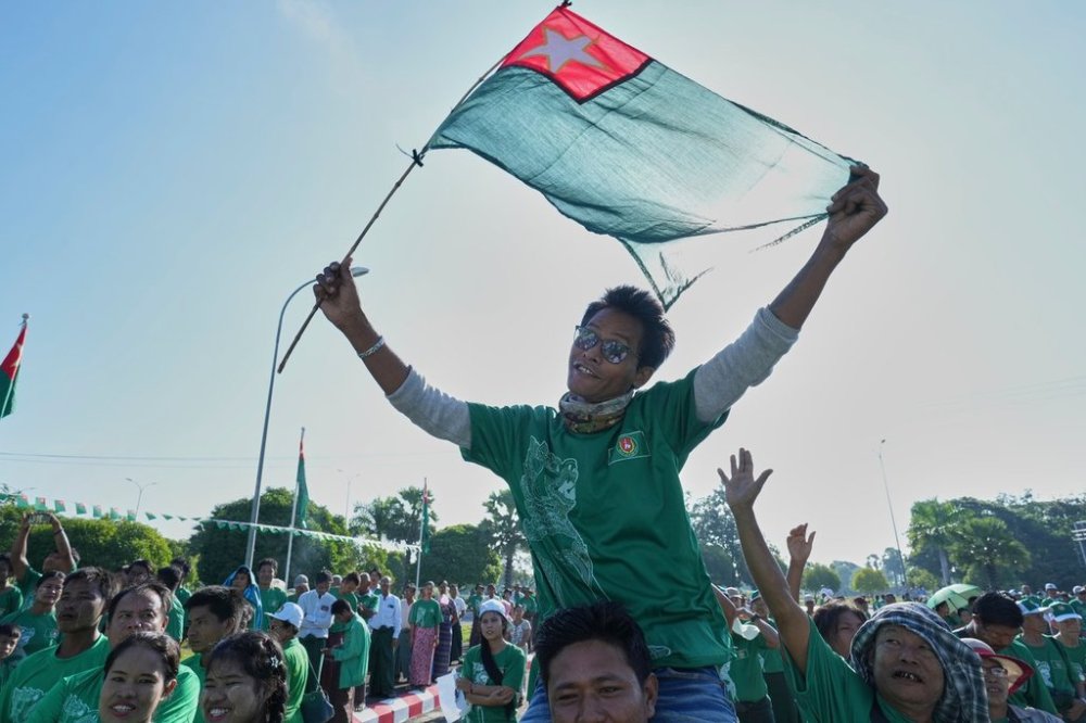 Supporters of the military-backed Union Solidarity and Development Party (USDP) wave the party flags during the first day of campaign for the upcoming general election, in Naypyitaw, Myanmar, Tuesday, Oct. 28, 2025.(AP Photo/Aung Shine Oo)