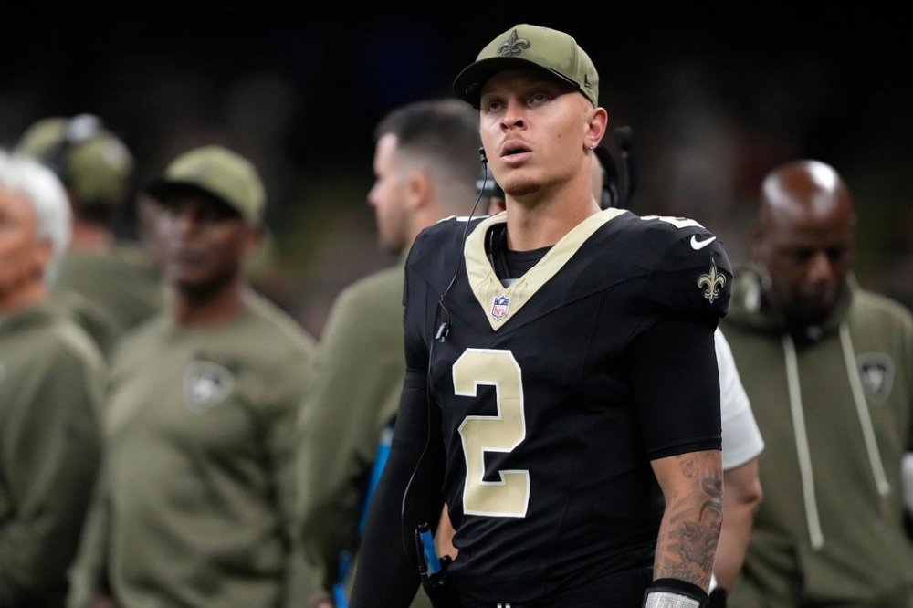 New Orleans Saints quarterback Spencer Rattler (2) looks on from the sideline after being taken out of the game against the Tampa Bay Buccaneers during the second half of an NFL football game Sunday, Oct. 26, 2025, in New Orleans. (AP Photo/Gerald Herbert)