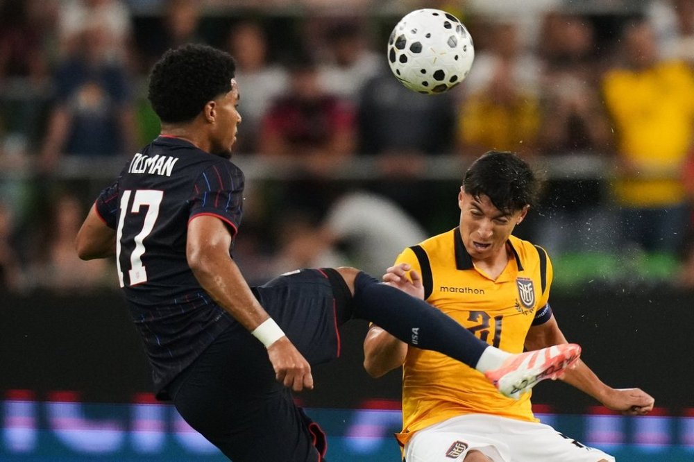 Ecuador midfielder Alan Franco (21) heads the ball away from United States midfielder Malik Tillman (17) during the second half of an international friendly soccer match in Austin, Texas, Friday, Oct. 10, 2025. (AP Photo/Eric Gay)