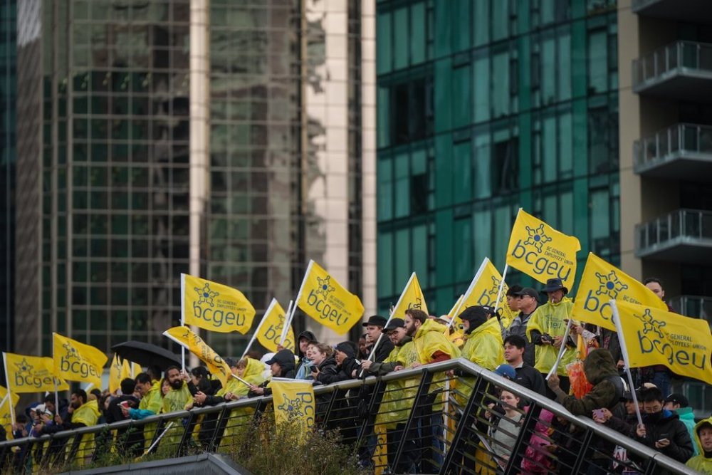 B.C. General Employees' Union (BCGEU) members and supporters attend a rally in Vancouver, on Wednesday, Oct. 1, 2025. Hundreds of British Columbia public sector workers marched through downtown Vancouver Wednesday in a push for a new contract, after talks with provincial government negotiators broke down shortly after they had resumed earlier this week. THE CANADIAN PRESS/Darryl Dyck