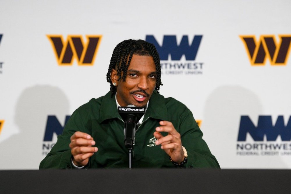 Washington Commanders quarterback Jayden Daniels speaks with reporters after an NFL football game against the Chicago Bears, Monday, Oct. 13, 2025, in Landover, Md. (AP Photo/Nick Wass)