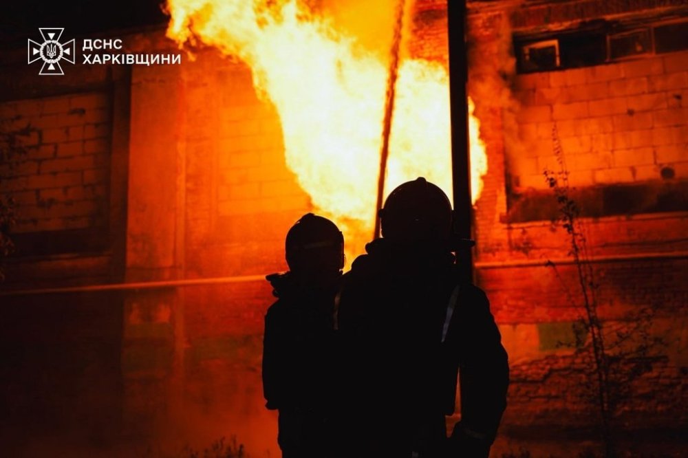 In this photo provided by the Ukrainian Emergency Services on Tuesday, Oct. 14, 2025, rescue workers put out a fire of a hospital damaged by a Russian strike in Kharkiv, Ukraine. (Ukrainian Emergency Service via AP)