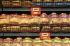 Signs advertise a price drop on bread at a No Frills Grocery store, in Toronto, on Thursday, May 30, 2024. THE CANADIAN PRESS/Chris Young