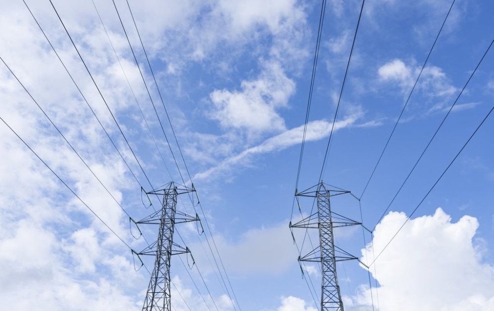 Hydro towers are seen in Montreal, Wednesday, Aug. 30, 2023.  THE CANADIAN PRESS/Christinne Muschi
