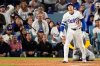 Los Angeles Dodgers' Shohei Ohtani watches his home run against the Milwaukee Brewers during the fourth inning in Game 4 of baseball's National League Championship Series, Friday, Oct. 17, 2025, in Los Angeles. (AP Photo/Mark J. Terrill)