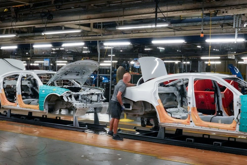 Cars pass along the assembly line at the Stellantis plant in Brampton, Ont. on Friday, July 21, 2023. THE CANADIAN PRESS/Chris Young