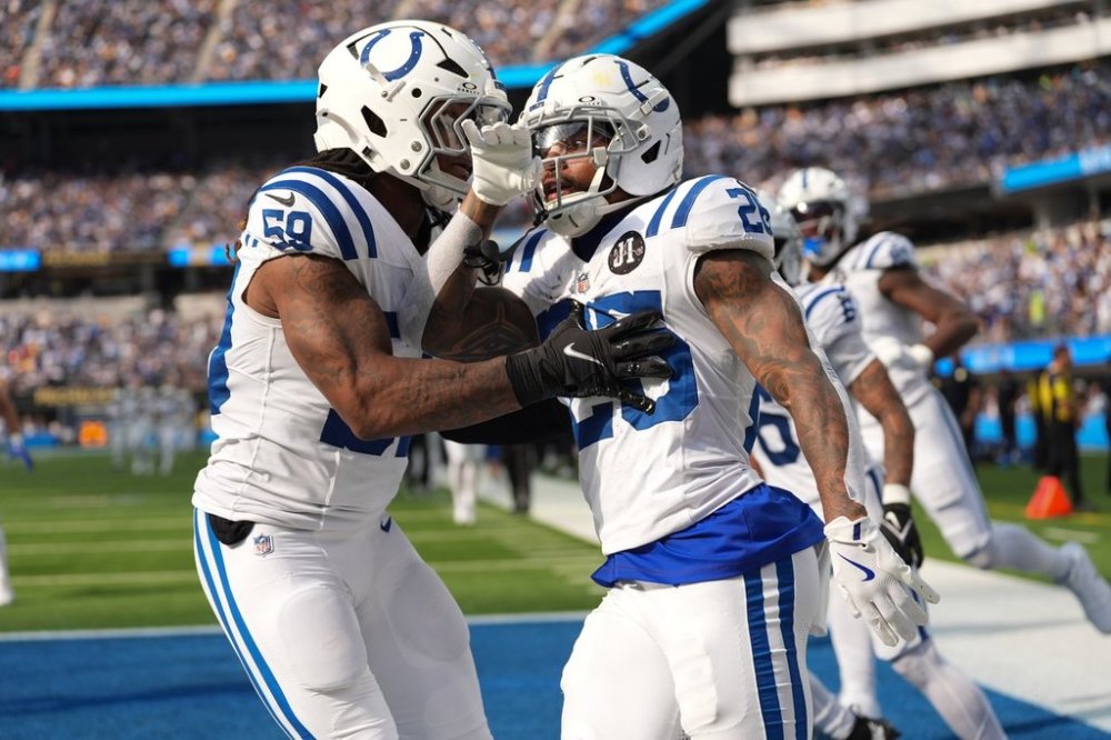 Indianapolis Colts running back Ameer Abdullah (26) celebrates a kickoff return with linebacker Buddy Johnson (59) against the Los Angeles Chargers during the second half of an NFL football game Sunday, Oct. 19, 2025, in Inglewood, Calif. (AP Photo/Gregory Bull)