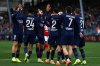 PSG's Achraf Hakimi, fourth from left, celebrates with his teammates after scoring his side's opening goal during the French League One soccer match between Brest and Paris Saint Germain in Brest, France, Saturday, Oct. 25, 2025. (AP Photo/Jeremias Gonzalez)