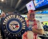 Toronto Blue Jays fan Geoffrey Fulton poses with his Blue Jays gear and maple leaf bandana during Game 7 of baseball's American League Championship Series between the Blue Jays and Seattle Mariners in Toronto, Monday, Oct. 20, 2025. (AP Photo/Rob Gillies)