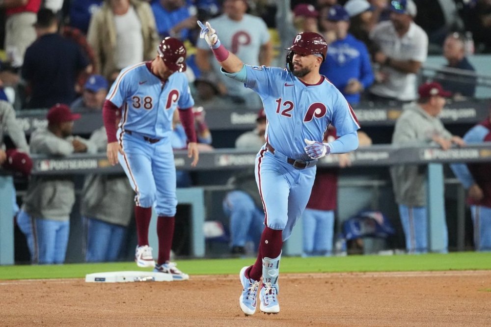 Philadelphia Phillies' Kyle Schwarber celebrates after hitting a solo home run during the fourth inning in Game 3 of baseball's National League Division Series against the Los Angeles Dodgers, Wednesday, Oct. 8, 2025, in Los Angeles. (AP Photo/Jae C. Hong)