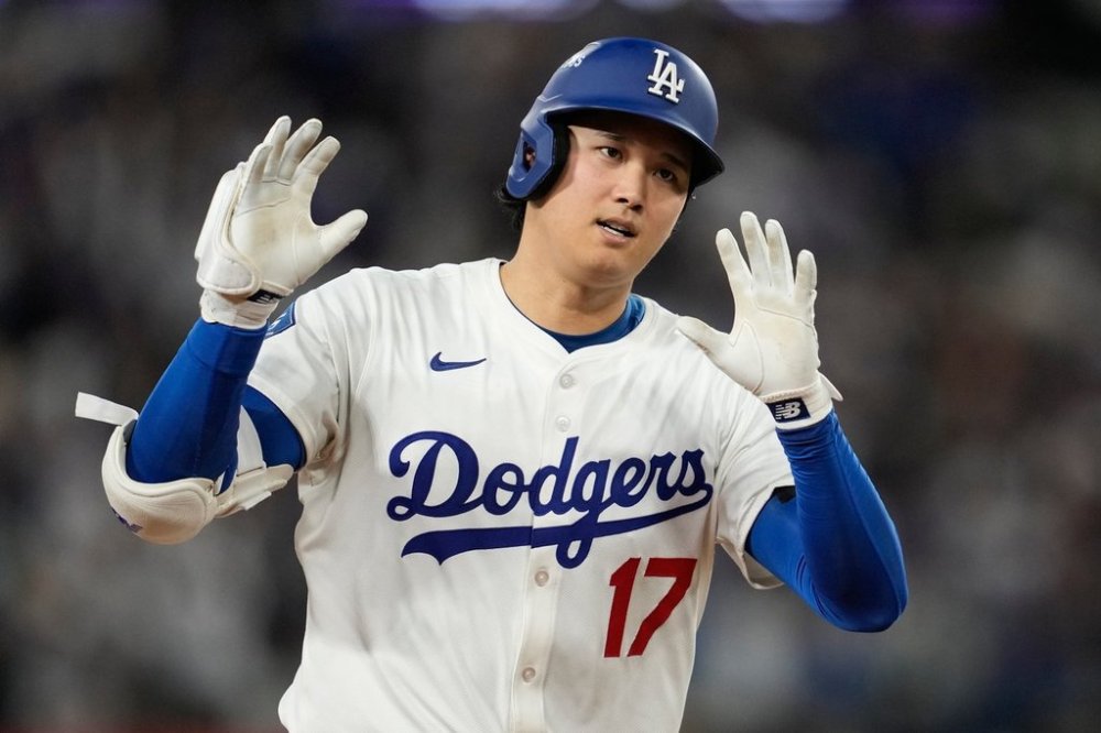 Los Angeles Dodgers' Shohei Ohtani celebrates his home run against the Milwaukee Brewers during the seventh inning in Game 4 of baseball's National League Championship Series, Friday, Oct. 17, 2025, in Los Angeles. (AP Photo/Ashley Landis)