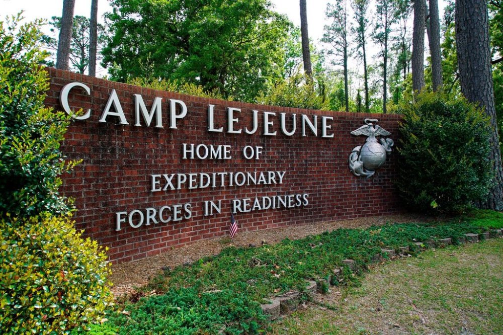 FILE - The main gate to Camp Lejeune Marine Base is seen outside Jacksonville, N.C., April 29, 2022. (AP Photo/Allen G. Breed, File)