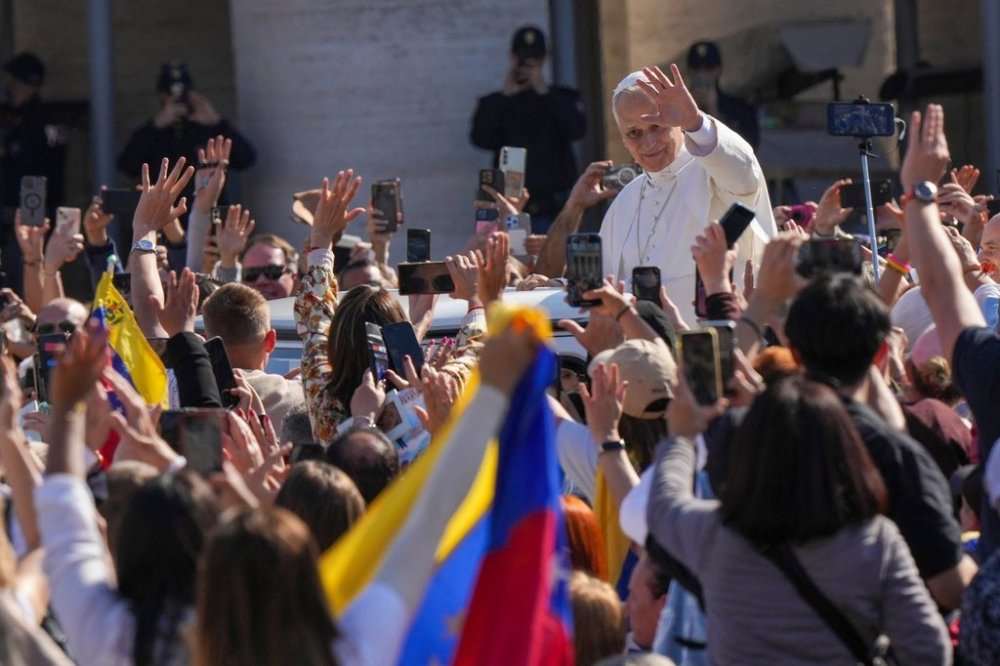 Pope Leo XIV tours on his popemobile after presiding over a Mass in St. Peter's Square at the Vatican during which he canonized seven new saints of the Catholic Church, Sunday, Oct. 19, 2025. (AP Photo/Andrew Medichini)
