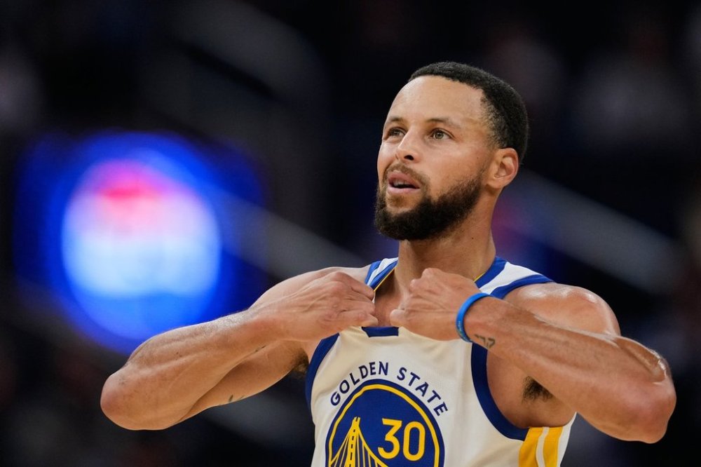 Golden State Warriors guard Stephen Curry reacts during the first half of an NBA basketball preseason game against the Portland Trail Blazers, Wednesday, Oct. 8, 2025, in San Francisco. (AP Photo/Godofredo A. Vásquez)