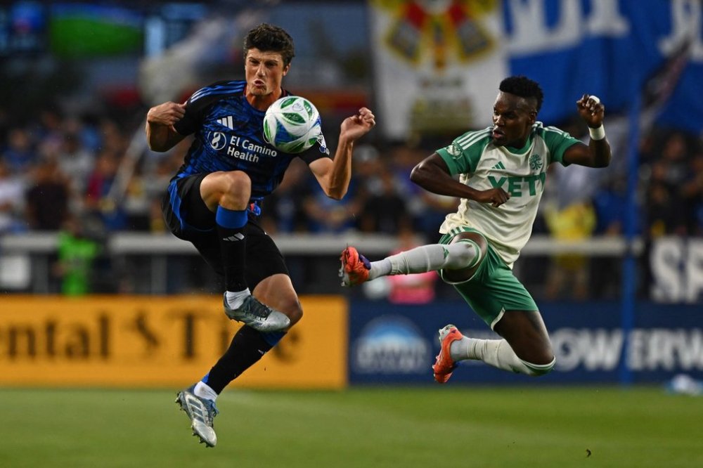 San Jose Earthquakes defender Daniel Munie (5) battles Austin FC forward Jáder Obrian (7) for the ball during the first half of their decision match play at PayPal Park in San Jose, Calif., on Saturday, Oct. 18, 2025. (Jose Carlos Fajardo/Bay Area News Group via AP)