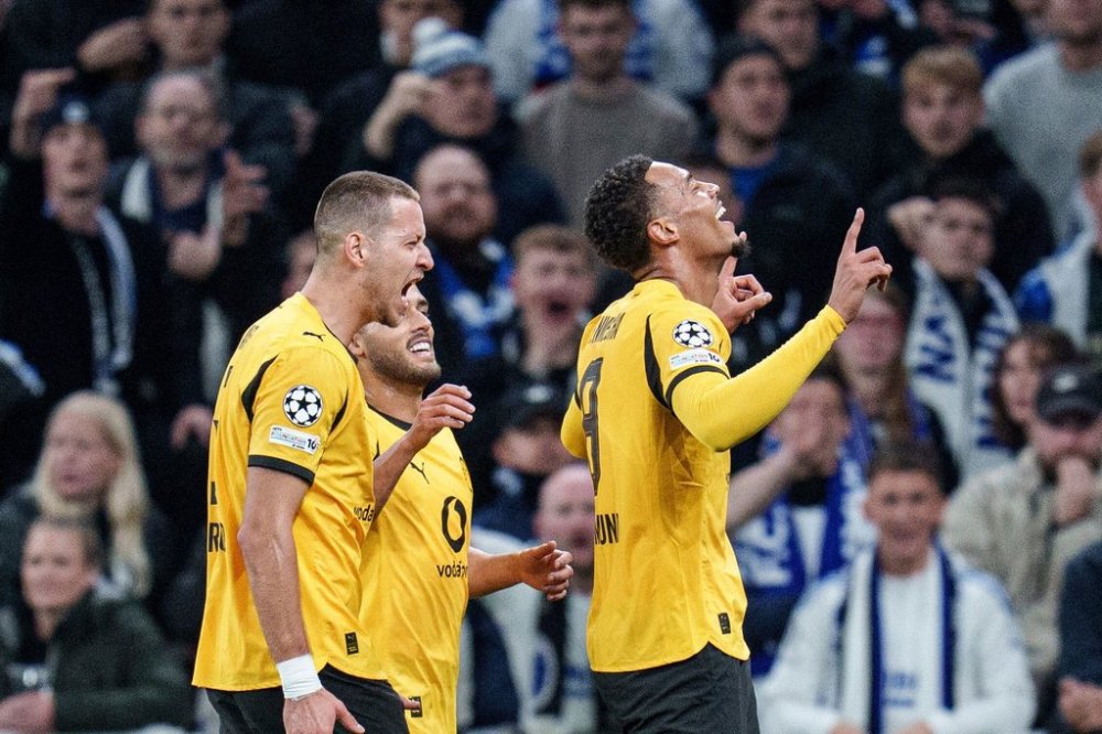 Borussia Dortmund's Felix Nmecha, right, celebrates scoring during the Champions League opening phase soccer match between FC Copenhagen and Borussia Dortmund at Parken in Copenhagen on Tuesday, Oct. 21, 2025. (Liselotte Sabroe/Ritzau Scanpix via AP)