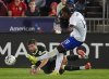 United States forward Haji Wright, front, kicks the ball for a goal as Australia defender Cameron Burgess covers in the second half of an international friendly soccer match Tuesday, Oct. 14, 2025, in Commerce City, Colo.(AP Photo/David Zalubowski)