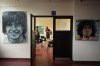 Paintings featuring the late soccer star Diego Maradona are displayed at the University of Social Sciences of Buenos Aires, where the international congress honoring him is taking place, in Buenos Aires, Argentina, Thursday, Nov. 6, 2025. (AP Photo/Natacha Pisarenko)
