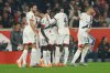 PSG's Nuno Mendes, centre left, celebrates with teammates after scoring the opening goal during the French League One soccer match between Lille and Paris Saint-Germain at the Stade Pierre-Mauroy in Villeneuve-d'Ascq, outside Lille, France, Sunday, Oct. 5, 2025. (AP Photo/Jean-Francois Badias)