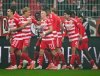 Union players celebrate after their first goal during the German Bundesliga soccer match between 1. FC Union Berlin and Borussia Moenchengladbach in Berlin, Friday, Oct. 17, 2025. (Soeren Stache/dpa via AP)