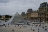 FILE - People walk outside the Louvre museum, Sunday, Aug. 31, 2025, in Paris. (AP Photo/Julia Demaree Nikhinson, File)