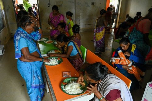 Evacuated Indian villagers of Uppada eat food in a temporary relief centre as Cyclone Montha, in Kakinada district of Andhra Pradesh, India, Tuesday, Oct. 28, 2025. (AP Photo)