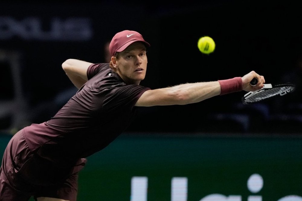 Italy's Jannik Sinner returns to Ben Shelton of the United States during a quarterfinal match of the Paris Masters tennis tournament in Paris, Friday, Oct. 31, 2025.((AP Photo/Michel Euler)
