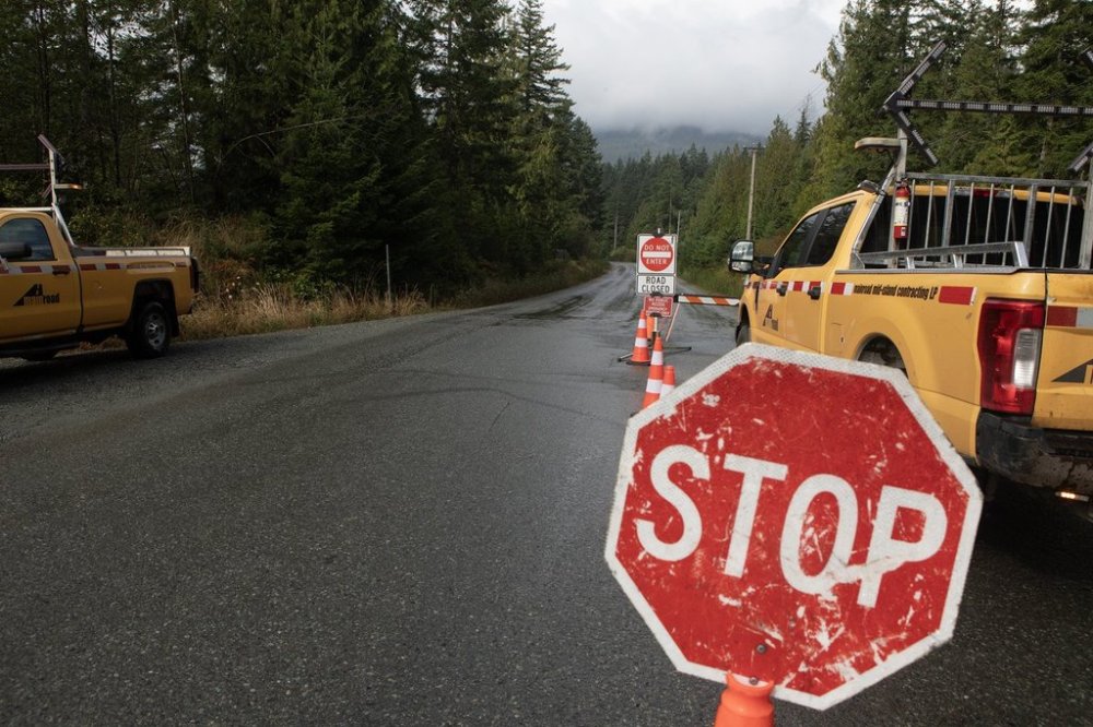 The road is seen closed at the Bamfield Main due to the Mount Underwood wildfire south of Port Alberni, B.C., on Saturday, Aug. 16, 2025. THE CANADIAN PRESS/Chad Hipolito