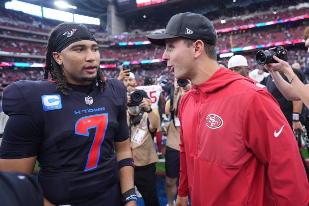 San Francisco 49ers quarterback Brock Purdy, left, talks with Houston Texans quarterback C.J. Stroud (7) following an NFL football game Sunday, Oct. 26, 2025, in Houston. (AP Photo/Eric Gay)