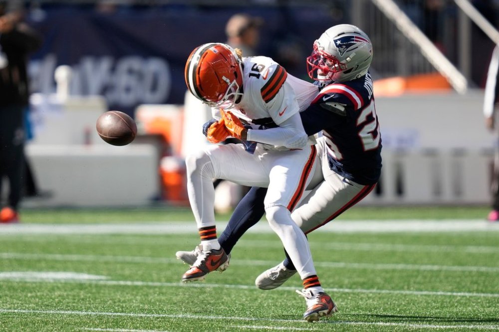 New England Patriots cornerback Marcus Jones (25) breaks up a pass intended for Cleveland Browns wide receiver Isaiah Bond (16) in the first half of an NFL football game on Sunday, Oct. 26, 2025, in Foxborough, Mass. (AP Photo/Charles Krupa)